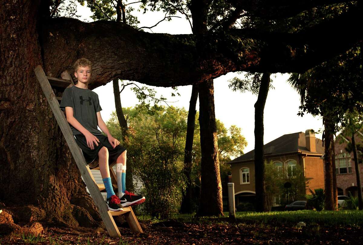 Justin Davis, 12, can no longer climb trees after the onset of Giant Axonal Neuropathy, a rare, nerve-debilitating genetic disease.