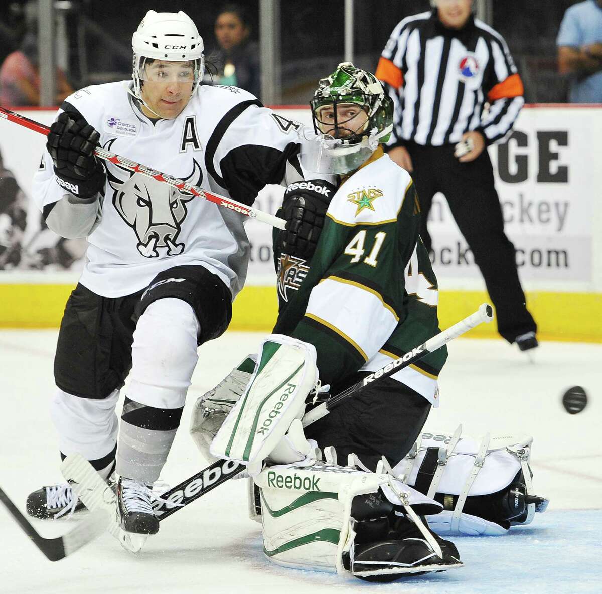 Rampage right wing Jed Ortmeyer (left) tussles with Texas goaltender Christopher Nilstorp during the second period at the AT&T Center. Garrett Wilson scored for the Rampage.