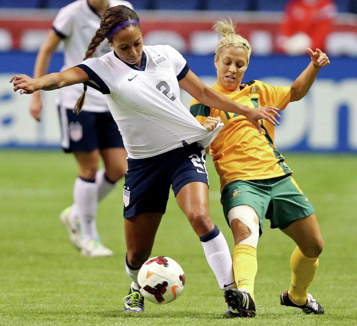 United States of America's Sydney Leroux and Australia's Katrina Gorry battle for control of the ball during first half action of an international friendly soccer match Sunday Oct. 20, 2013 at the Alamodome.