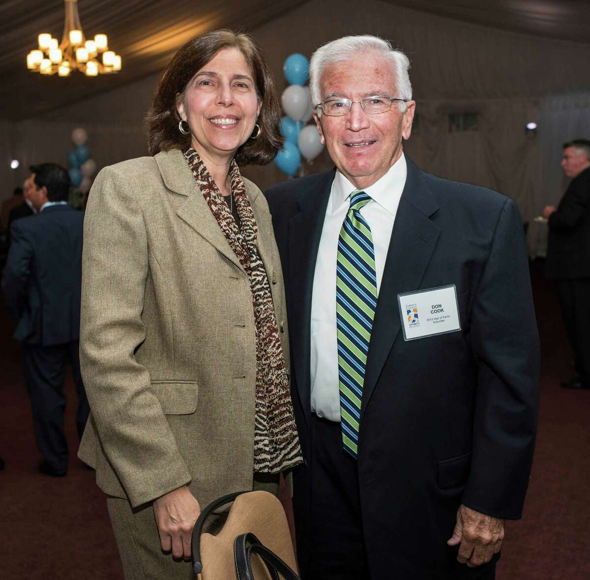 Community service award winner, Don Cook with Janet Canepa at the 9th annual Fairfield County Sports Hall of Fame Sports Night held at the Greenwich Hyatt Regency, Greenwich, CT on Monday, October, 21st, 2013.