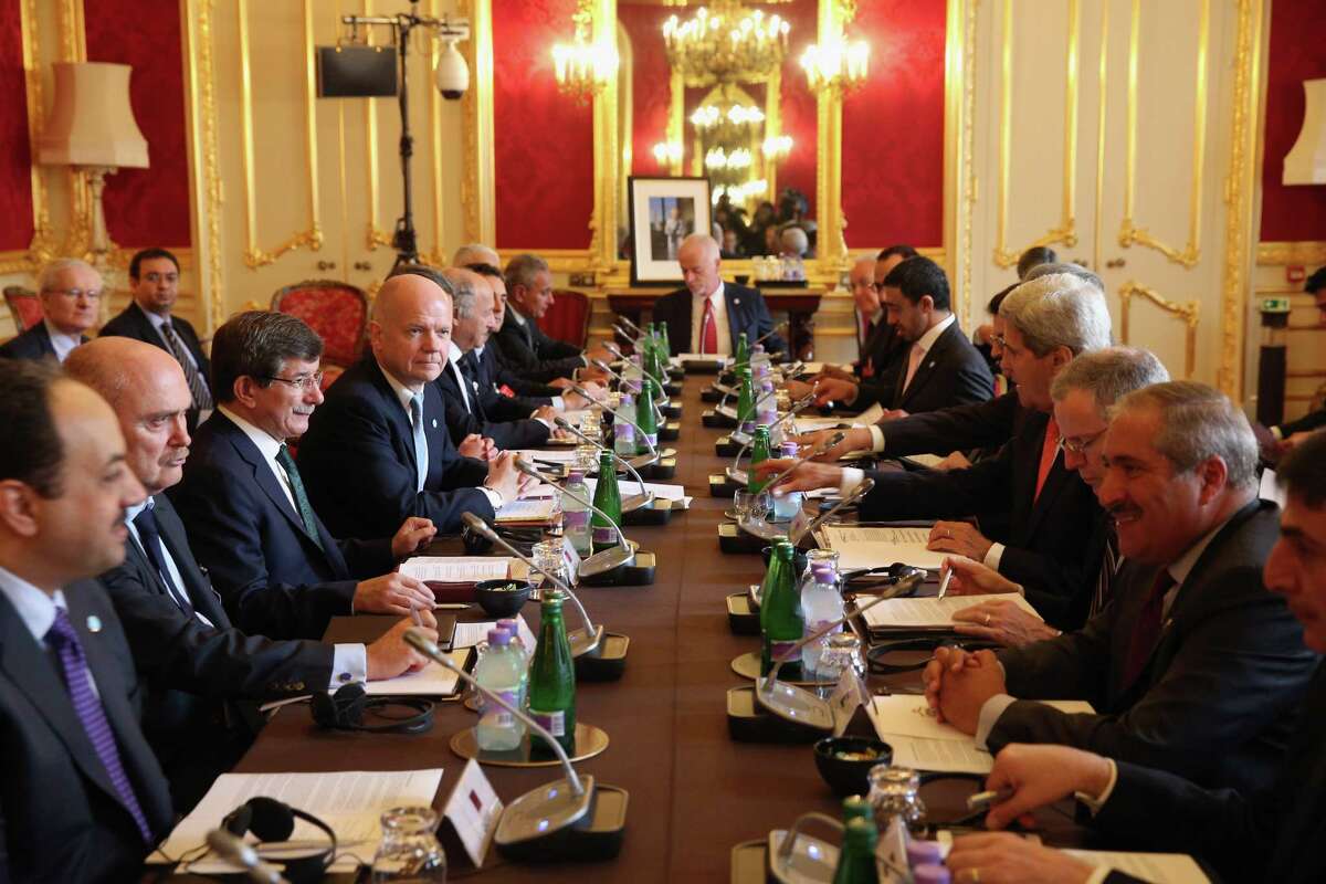 US Secretary of State John Kerry, fourth from right, attends a meeting Tuesday Oct. 22, 2013, hosted by British Foreign Secretary William Hague, fourth from left, of the 'London 11', from the Friends of Syria Core Group, in Lancaster House, central London, aimed at ending the brutal civil war in Syria.(AP Photo/Oli Scarff, pool)