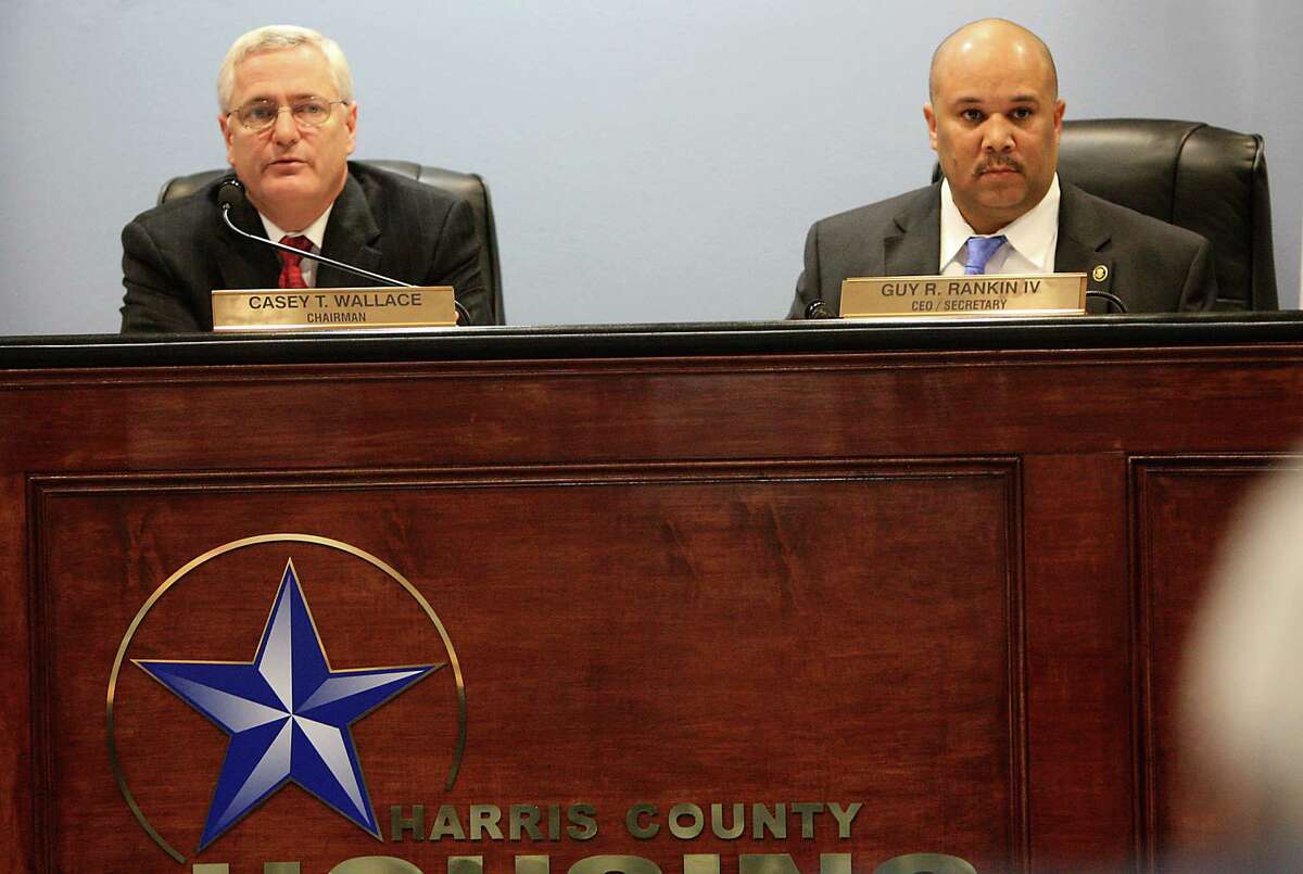 Harris County Housing Authority (HCHA) CEO Guy Rankin, right, sits next to chairman Casey Wallace, left, during the HCHA board meeting on Tuesday, Feb. 7, 2012, in Houston. They have since left the authority.