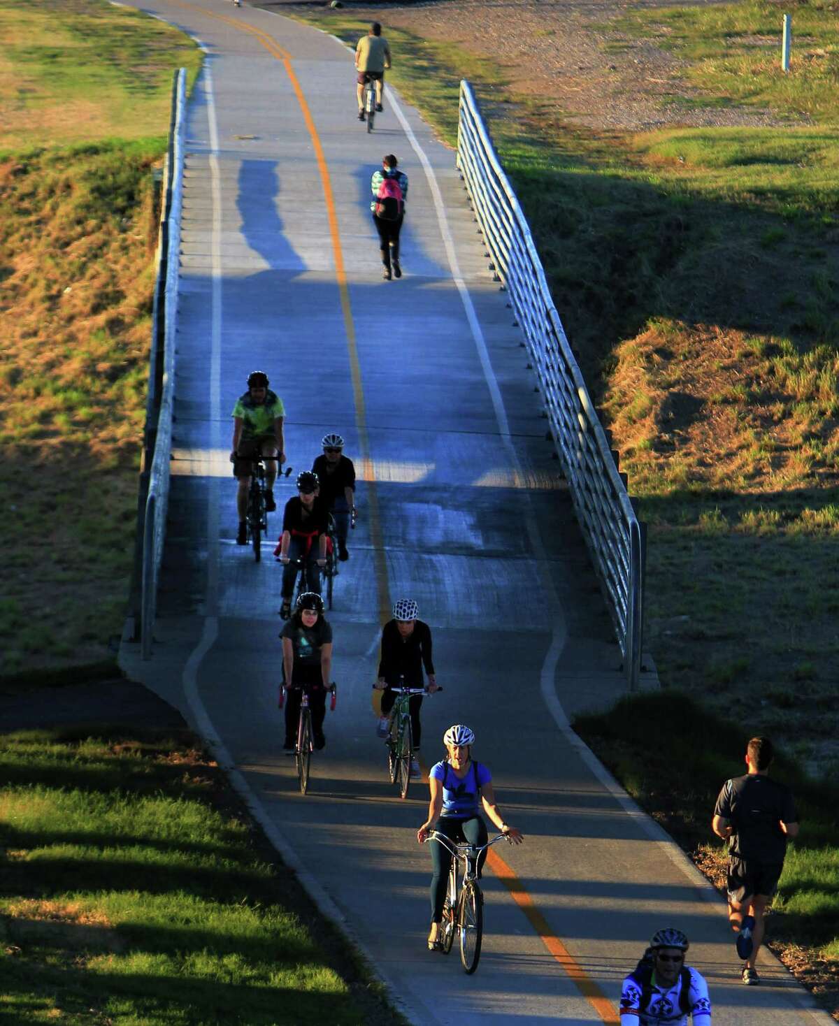 Tuesday's crisp, sunny weather lured cyclists and joggers onto the Heights Bike Trail ride over White Oak Bayou and under Interstate 10 near downtown.