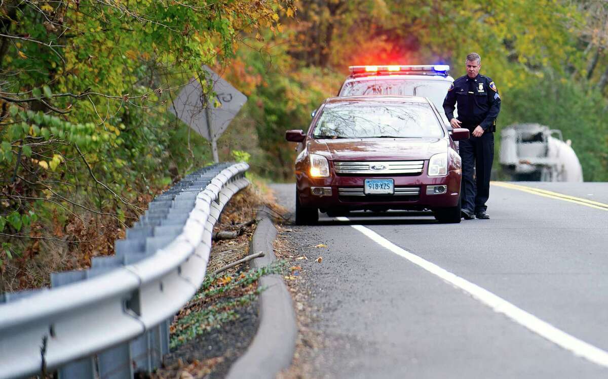 Stamford police Sgt. Andrew Gallagher stops a driver for speeding on High Ridge Road on Wednesday, October 23, 2013.