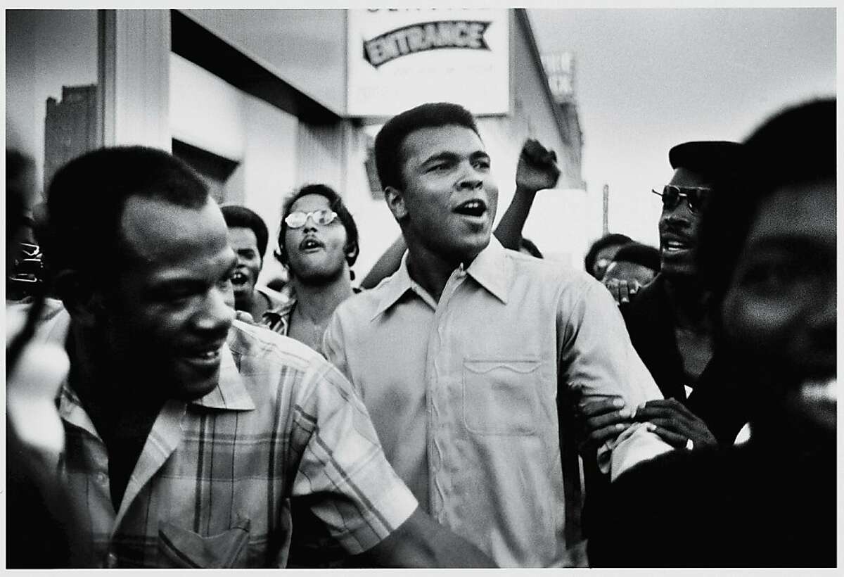 Muhammad Ali walks through the streets of New York City with members of the Black Panther Party in September 1970.