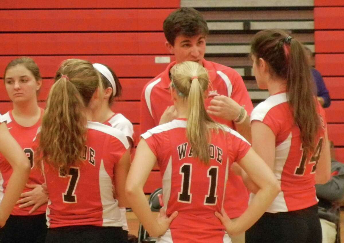 Fairfield Warde coach Matt Narwold talks to his team during a break in the action in an FCIAC girls volleyball match on Wednesday, Oct. 23. The Mustangs lost to Stamford 3-1.