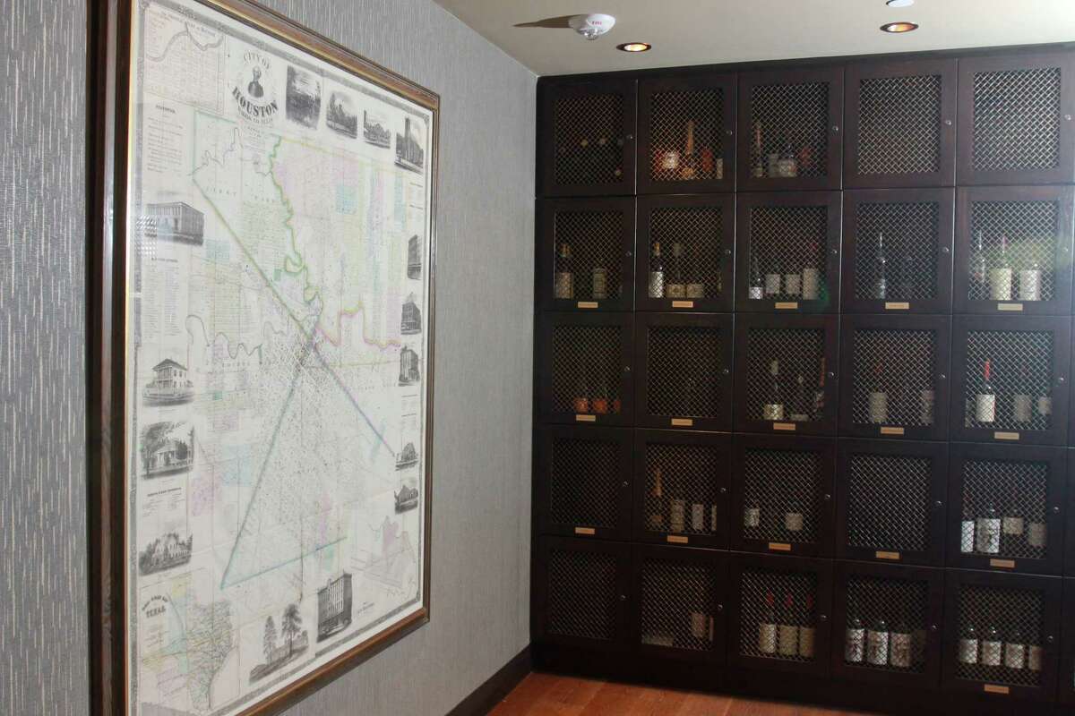 (For the Chronicle/Gary Fountain, October 21, 2013) Map of Houston and members' wine lockers at the entrance to Allen's Landing at the Houston Club, 910 Louisiana Street, at One Shell Plaza.
