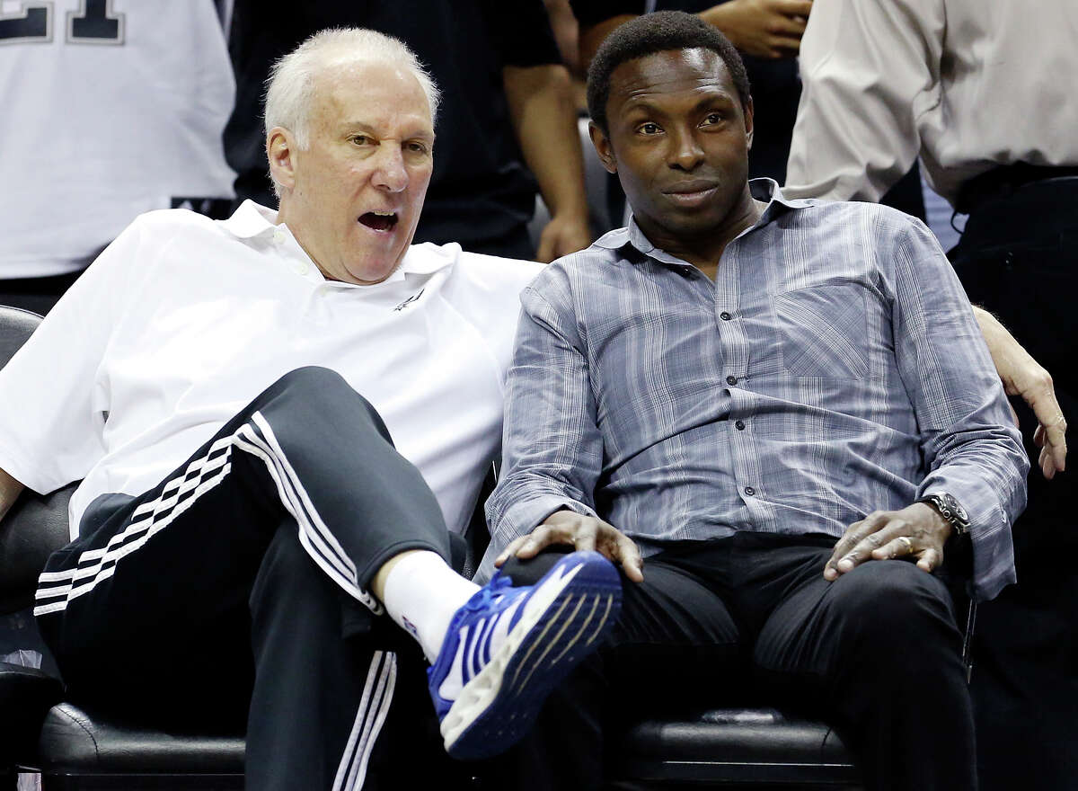Spurs head coach Gregg Popovich (left) talks with former Spurs player Avery Johnson during an open scrimmage held Sunday Oct. 6 2013 at the AT&T Center.