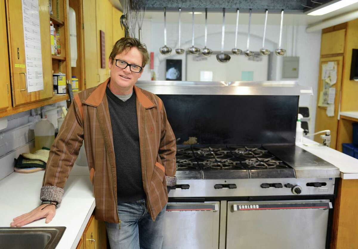 Sherman musician Don Lowe poses inside the kitchen of Loaves & Fishes food bank in New Milford, Conn. on Friday, Oct. 25, 2013. Lowe is one of a group of artists and poets participating in a benefit organized by Voices of Poetry that will be held at Loaves and Fishes on Nov. 9. Lowe said he likes to use his music to help others “because I want to feel like I have a voice in this world.”