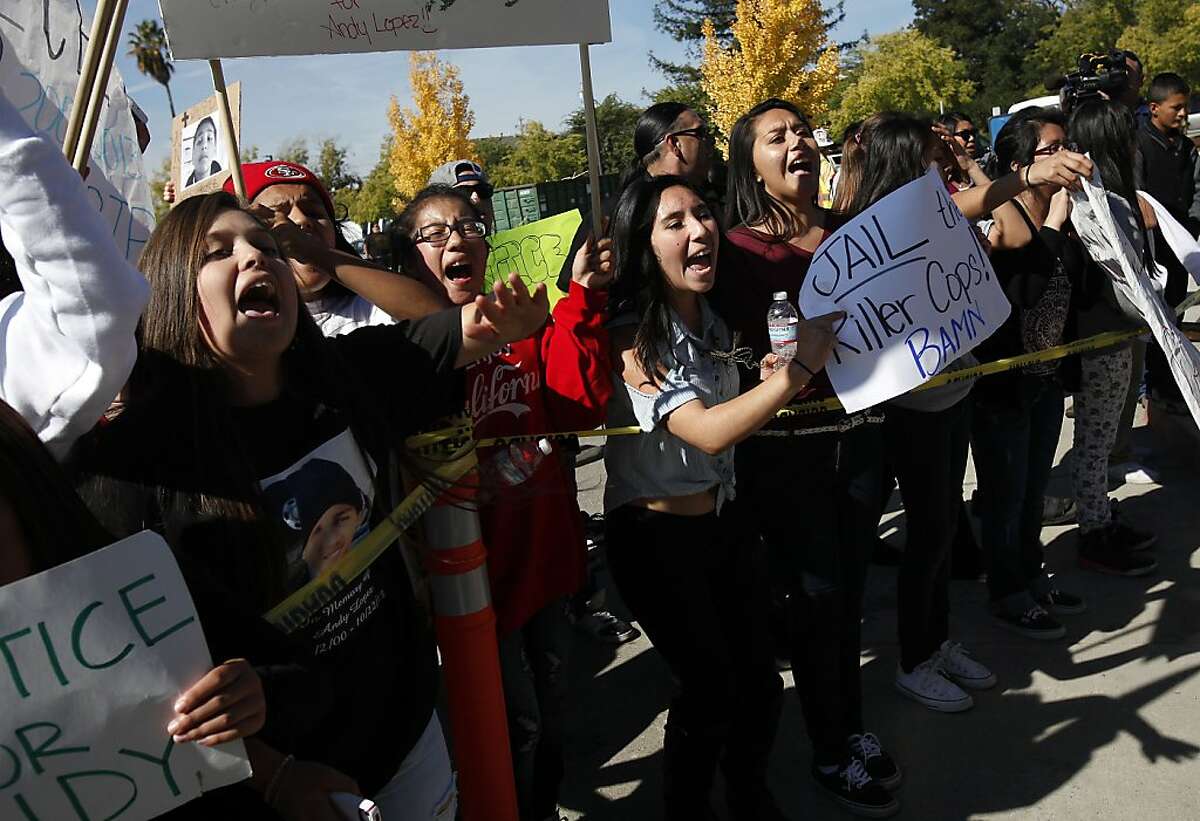 Protestors arrive at the Sheriff's office after marching through Santa Rosa demanding justice for Andy Lopez Cruz, 13, in Santa Rosa, Calif., on Friday, October 25, 2013. The eighth-grader was killed by police while walking near his home carrying a toy rifle.