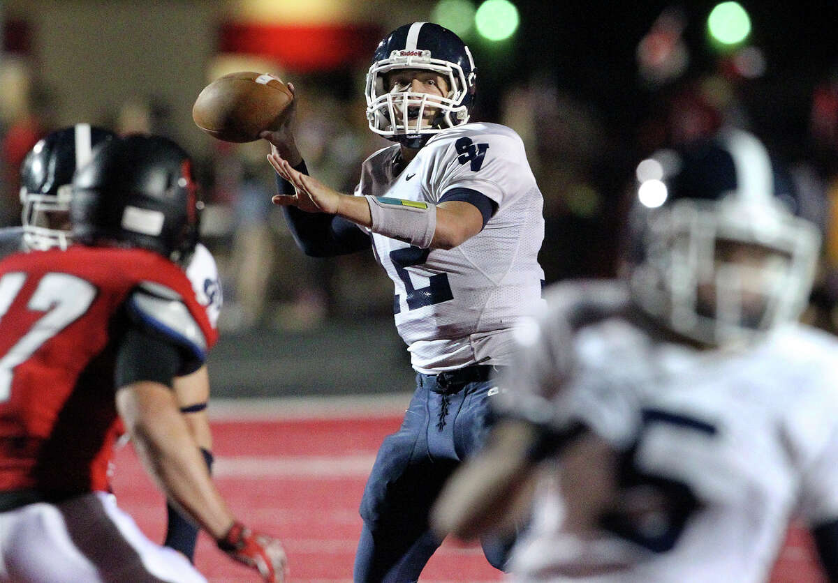 Ranger quarterback Garrett Smith picks a receiver in the first half as Canyon hosts Smithson Valley at Canyon High School Stadium in New Braunfels on October 25, 2013.