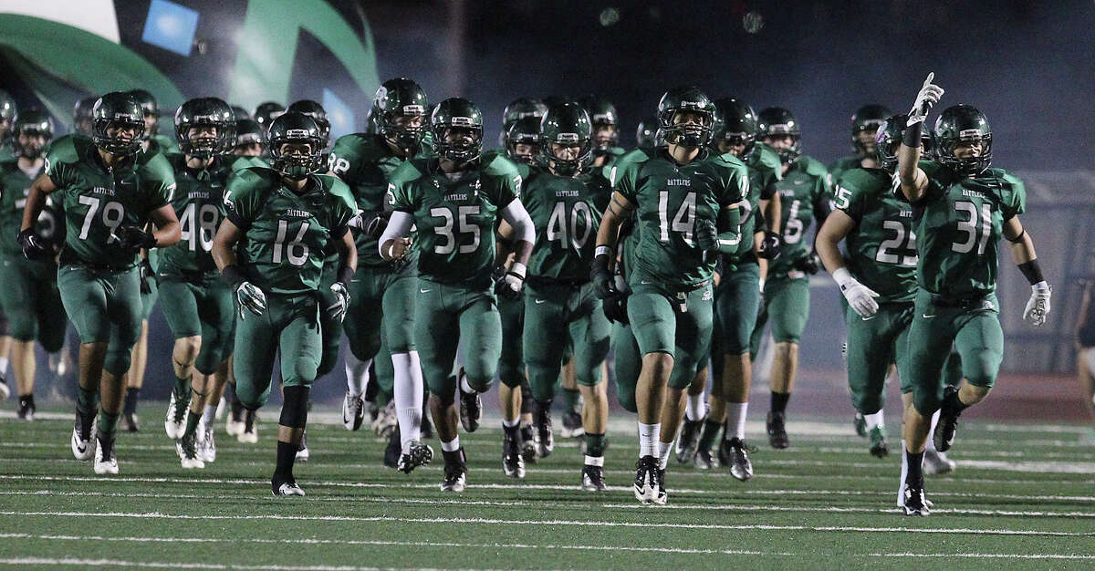 The Reagan Rattlers take the field for their game against the Johnson Jaguars at Comalander Stadium on Friday, Oct. 25, 2013.