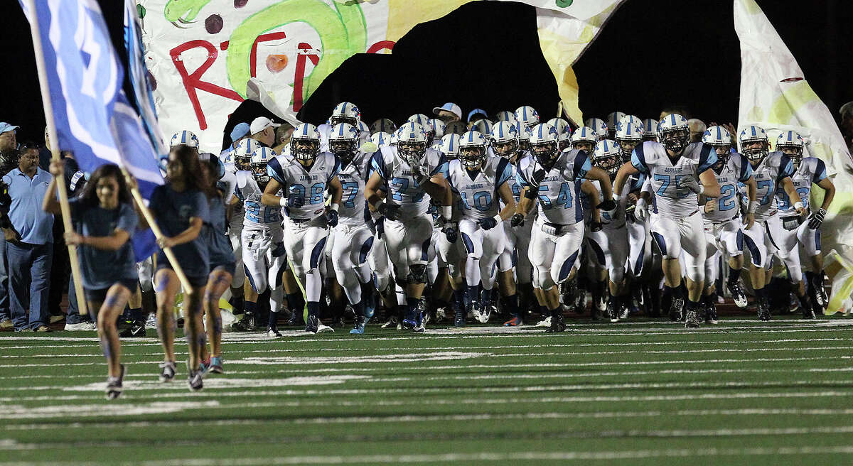 The Johnson Jaguars take the field for their game against the Reagan Rattlers at Comalander Stadium on Friday, Oct. 25, 2013.