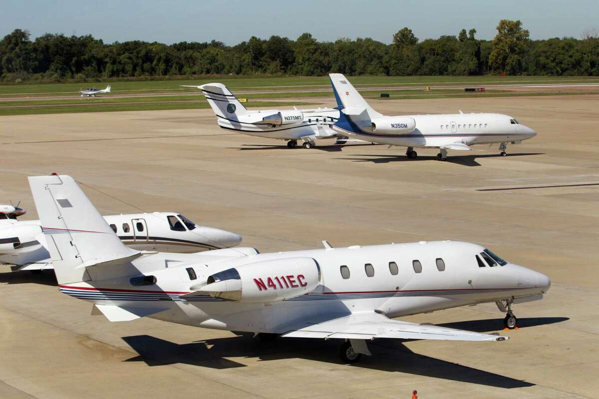 Various aircraft are shown parked on the tarmac at the Sugar Land Regional Airport October 2013  in Sugar Land.