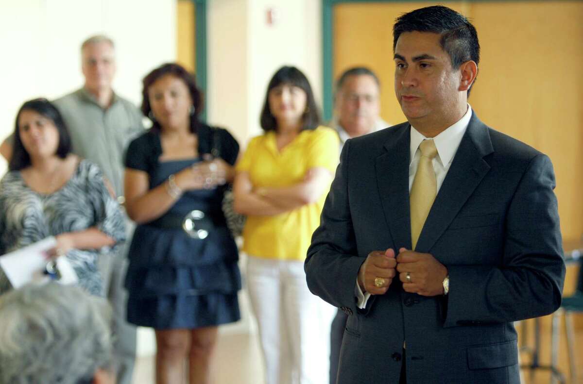 Newly appointed Edgewood ISD superintendent Jose A. Cervantes speaks Friday evening June 17, 2011 to the audience moments after the school board voted to hire the Alpine ISD superintendent. The board voted 4-0 with three members not in attendance. (William Luther/wluther@express-news.net)