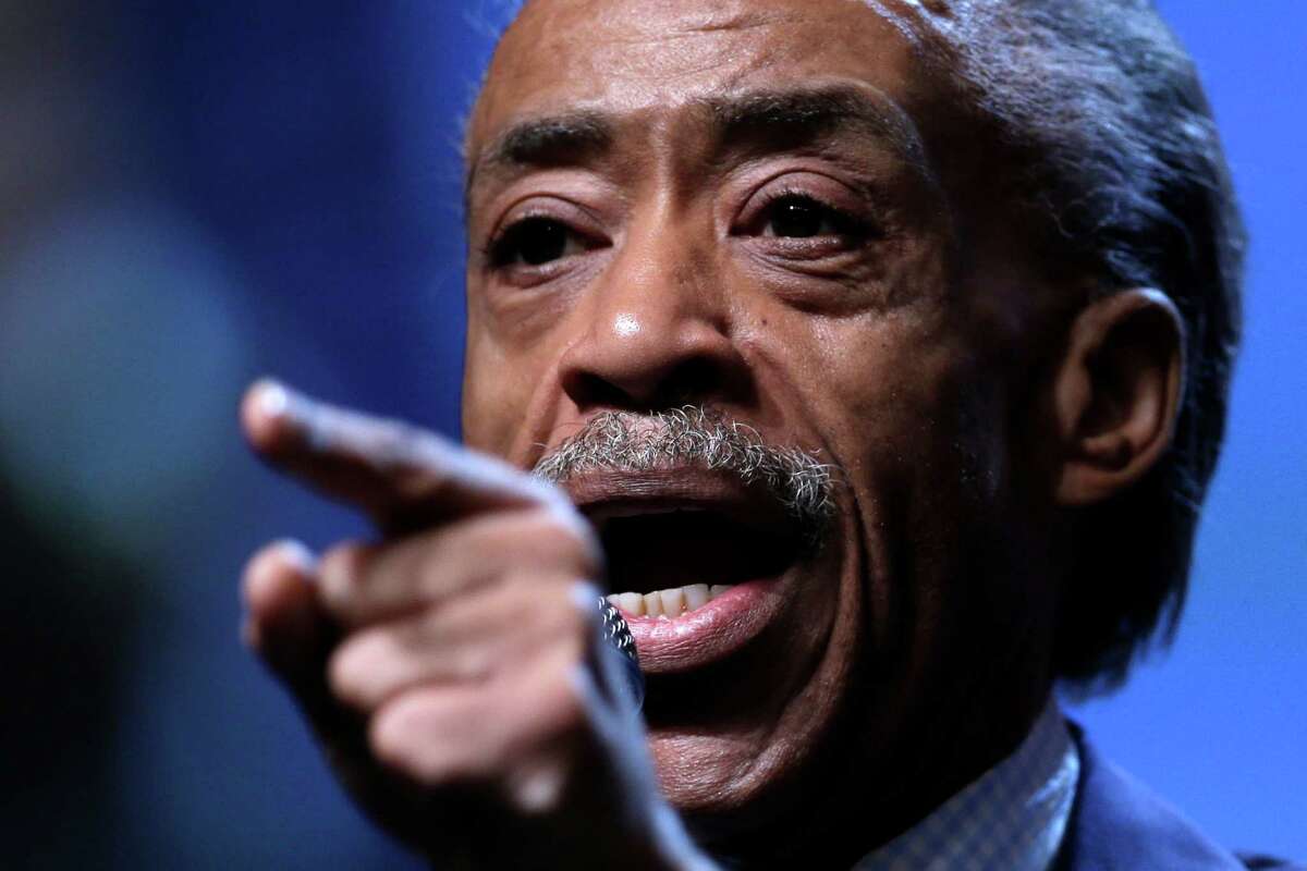 File- This July 26, 2013 file photo shows the Rev. Al Sharpton gestures as he takes part in a panel discussion during the National Urban League's annual conference in Philadelphia. Sharpton is threatening to boycott luxury retailer Barneys over allegations by shoppers that they were racially profiled there. Sharpton said Saturday Oct. 26, 2013, that black New Yorkers "are not going to live in a town where our money is considered suspect and everyone else's money is respected." (AP Photo/Matt Rourke, File)