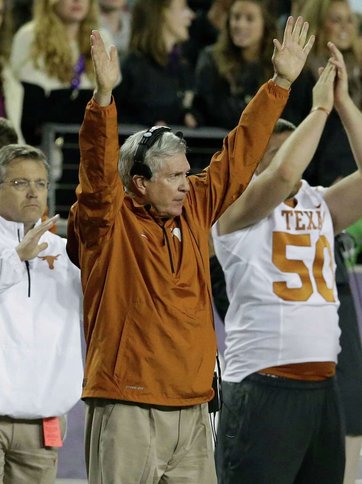 Texas head coach Mack Brown celebrates his team scoring a field goal during the second half of an NCAA college football game against TCU Sunday, Oct. 27, 2013, in Fort Worth, Texas. (AP Photo/LM Otero)