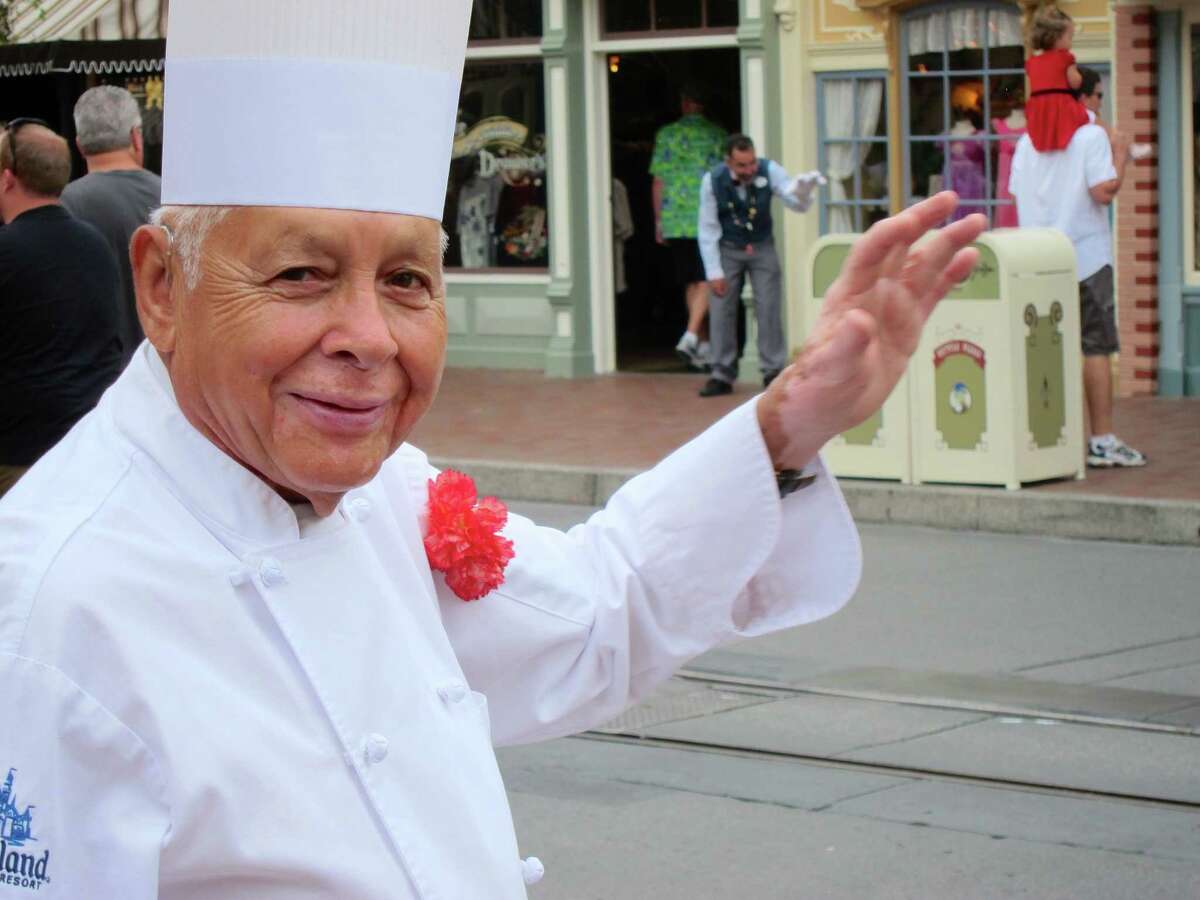 In this photo taken Sept. 20, 2013, Oscar Martinez, 77, greets diners at the Carnation Cafe at Disneyland in Anaheim, Calif. The chef is the park’s longest-tenured employee, beginning as a busboy nearly 57 years ago. He says he loves his job, and a new poll from the Associated Press-NORC Center for Public Affairs finds he’s not alone: Nine out of ten workers 50 and older say they’re satisfied with their work.