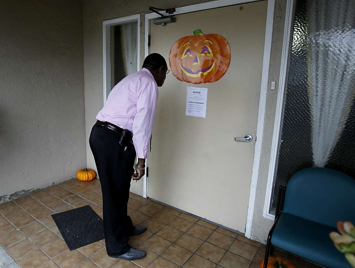 Deacon Oscar Moore Jr. read the notice on the front door after trying to visit a relative inside Sunday October 27, 2013 in Castro Valley, Calif. The Valley Manor Community Care Home was shut down by the state and residents taken to local hospitals after much of the nursing staff left.
