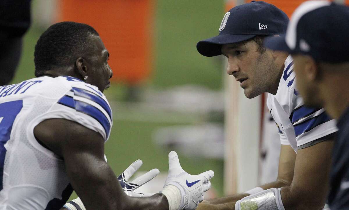 Dallas Cowboys wide receiver Dez Bryant (88) and Dallas Cowboys quarterback Tony Romo (9) talk on the sideline after an argument in the second half of an NFL game against the Detroit Lions at Ford Field in Detroit, Michigan, on Sunday, October 27, 2013. (Brad Loper/Dallas Morning News/MCT)