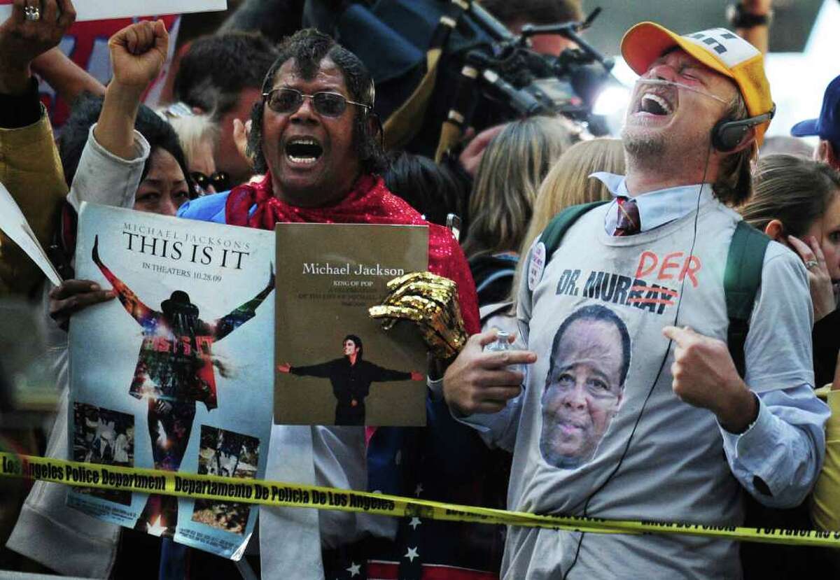 Supporters of Michael Jackson holding placards outside the courthouse react to the announcement of the verdict of his doctor's trial in Los Angeles on November 7, 2011 in southern California. Michael Jackson's doctor Conrad Murray was found guilty of involuntary manslaughter over the King of Pop's 2009 death, the court clerk said. There was a brief cry in the courtroom, and cheers outside, but Murray himself gave no reaction when the long-awaited verdict was announced after a six-week trial in Los Angeles.
