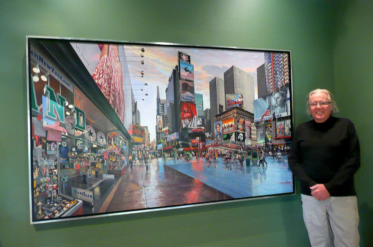 Art collector Richard McKenzie stands by "Time Square" by Robert Neffson.