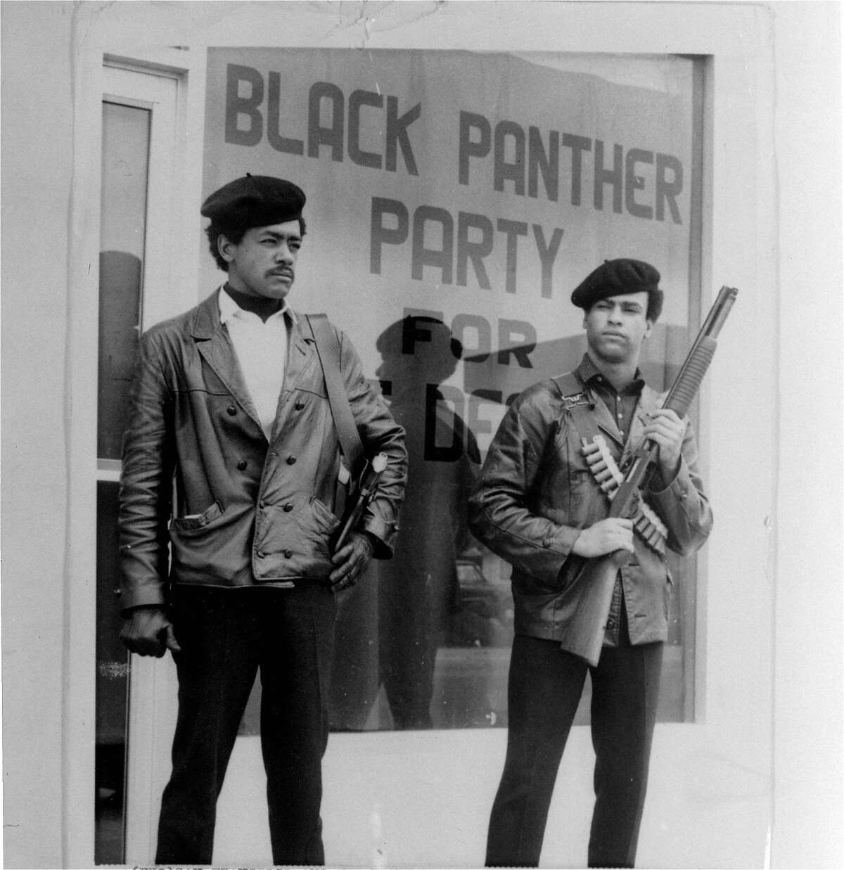 This is an undated photo of Black Panther national chairman Bobby Seale, wearing a Colt .45, left, and Huey Newton, defense minister with a bandoleer and shotgun in Oakland.