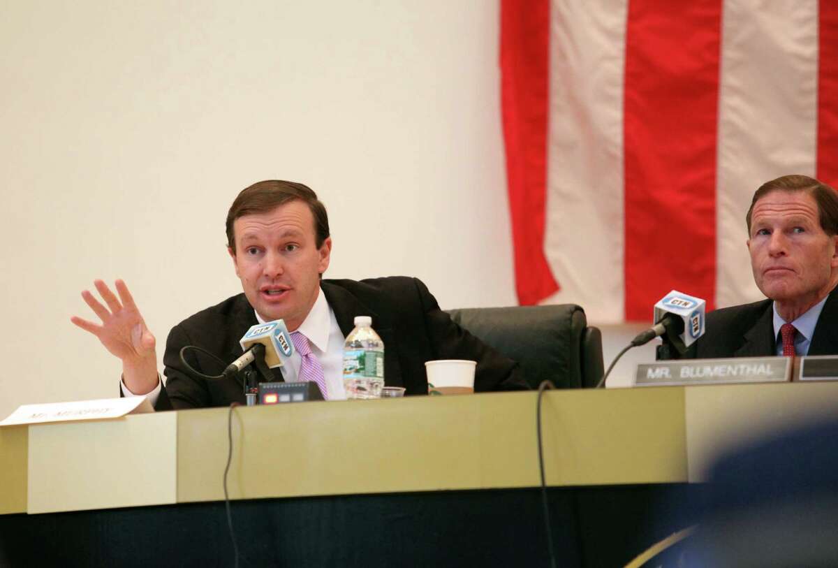 Senator Christopher Murphy, left, and Sen. Richard Blumenthal question a panel during a hearing on the September Metro North power outage at Bridgeport City Hall on Monday, Oct. 28, 2013.