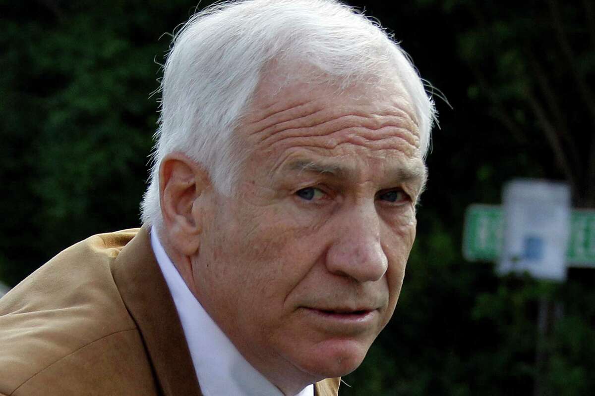 FILE - In this June 22, 2012 file photo, former Penn State assistant football coach Jerry Sandusky arrives at the Centre County Courthouse in Bellefonte, Pa. Penn State said Monday, Oct. 28, 2013 that it is paying $59.7 million to 26 young men over claims of child sexual abuse at the hands of Sandusky. The university said it had concluded negotiations that have lasted about a year. The school said 23 deals are fully signed and three are agreements in principle. The school faces six other claims, and the university says it believes some do not have merit while others may produce settlements. Sandusky, 69, is serving a 30- to 60-year prison sentence at a state prison in southwestern Pennsylvania. (AP Photo/Gene J. Puskar, File)