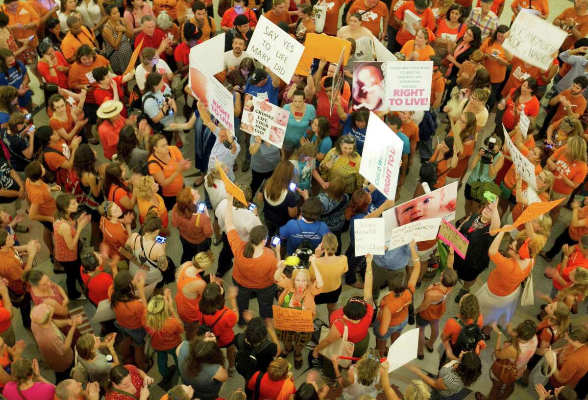 Impassioned crowds from both sides of the abortion debate gathered in the Capitol rotunda in July as lawmakers debated the controversial bill that became law, a key provision of which was struck down Monday.