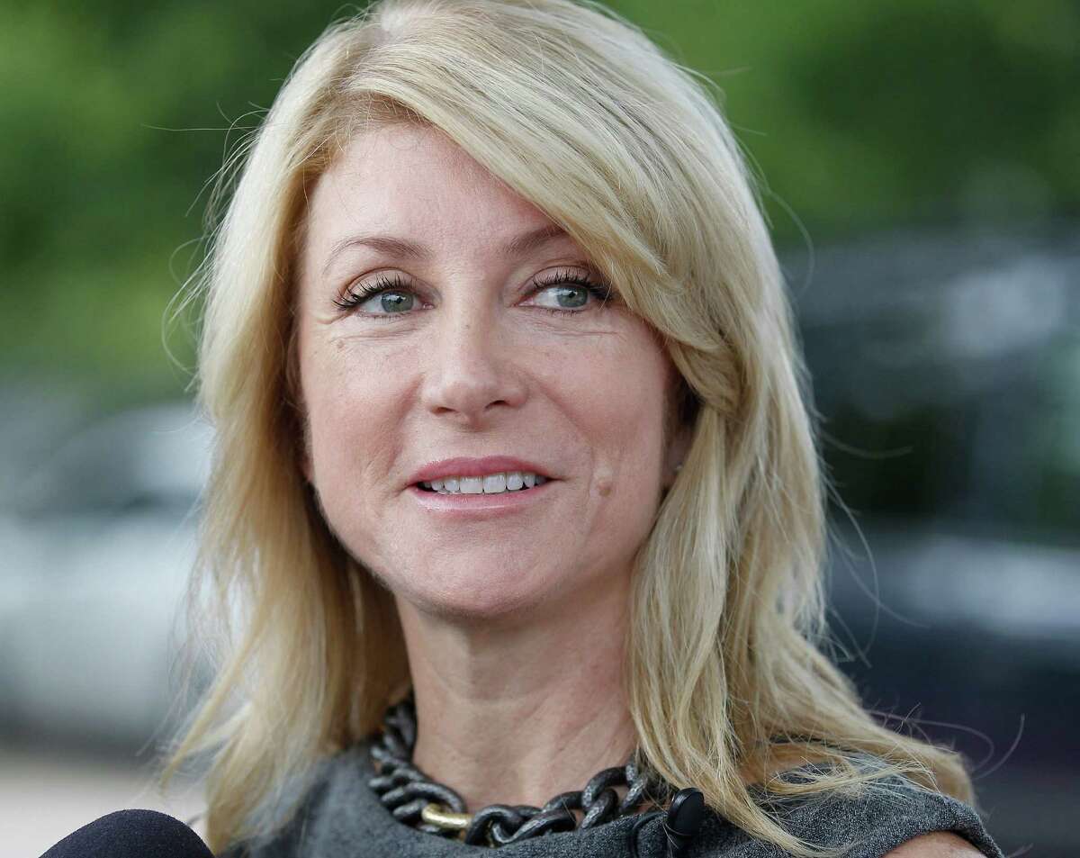 State Senator Wendy Davis speaks with reporters after voting at the Southside Community Center in east Fort Worth, Texas on Monday, October 18, 2013. (Star-Telegram/Ron T. Ennis)