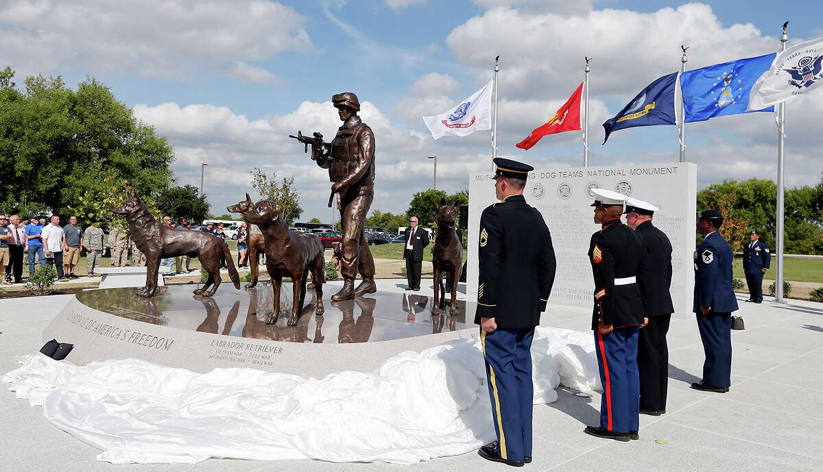 The U.S. Military Working Dog Teams National Monument is unveiled during the dedication ceremony Monday Oct. 28, 2013 at Joint Base San Antonio- Lackland.