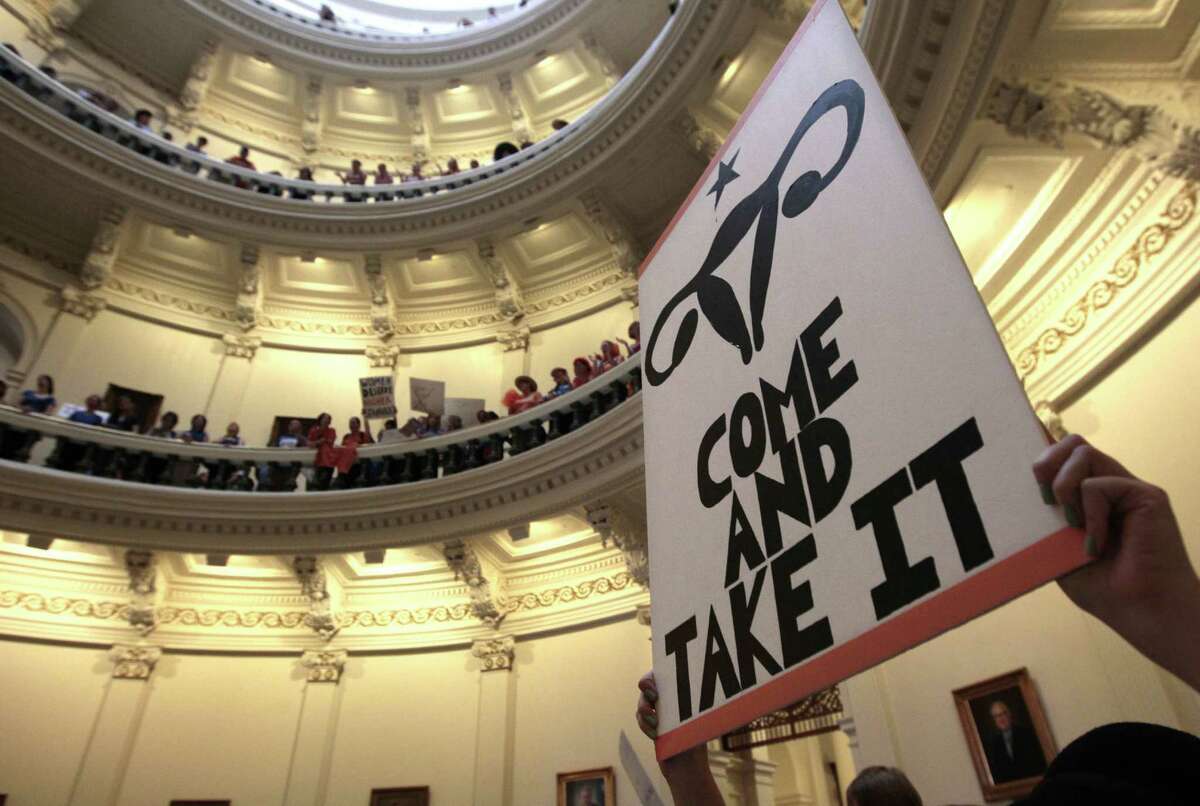 Abortion-right supporters rally at the Texas Capitol in July, before the new law was signed into law.