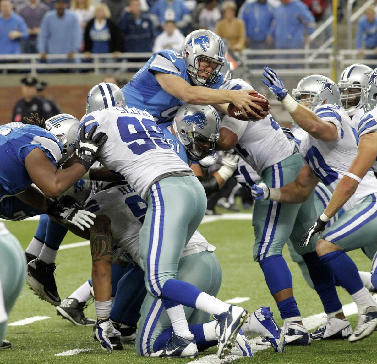 Detroit Lions quarterback Matthew Stafford scores a touchdown against the Dallas Cowboys in the fourth quarter at Ford Field in Detroit, Michigan, on Sunday, October 27, 2013, (Rodger Mallison/Fort Worth Star-Telegram/MCT)