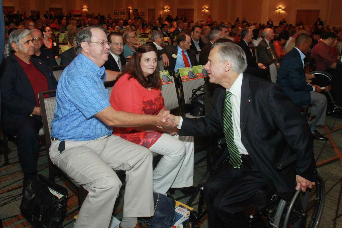 John and Denise Guenther greet Republican gubernatorial candidate Greg Abbott after he spoke at the Take Back Harris County rally on Monday night.