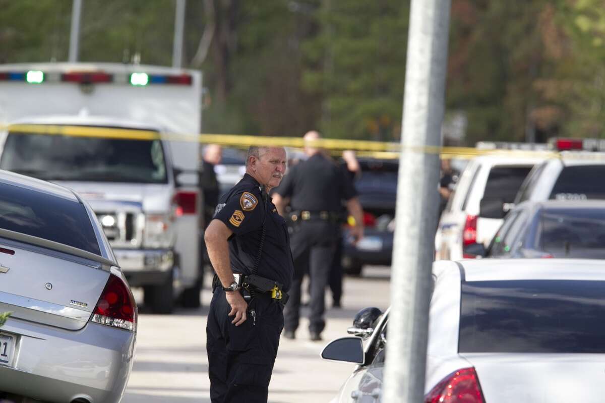 A Harris County Sheriff Deputy at the scene of a shooting on Hollister near Bourgeois Monday, Nov. 21, 2011, in Houston. ( James Nielsen / Chronicle )