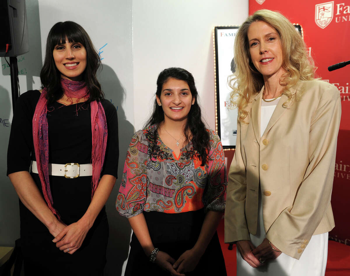 From left, Nicole Juliano Peranick, Jamie Ramerini and Daphne Dixon pose during the opening ceremony of the new Fairfield University Accelerator and Mentoring Enterprise (FAME), in Fairfield, Conn., Oct. 29, 2013. The three women and their businesses have been selected to be part of the business incubator program.