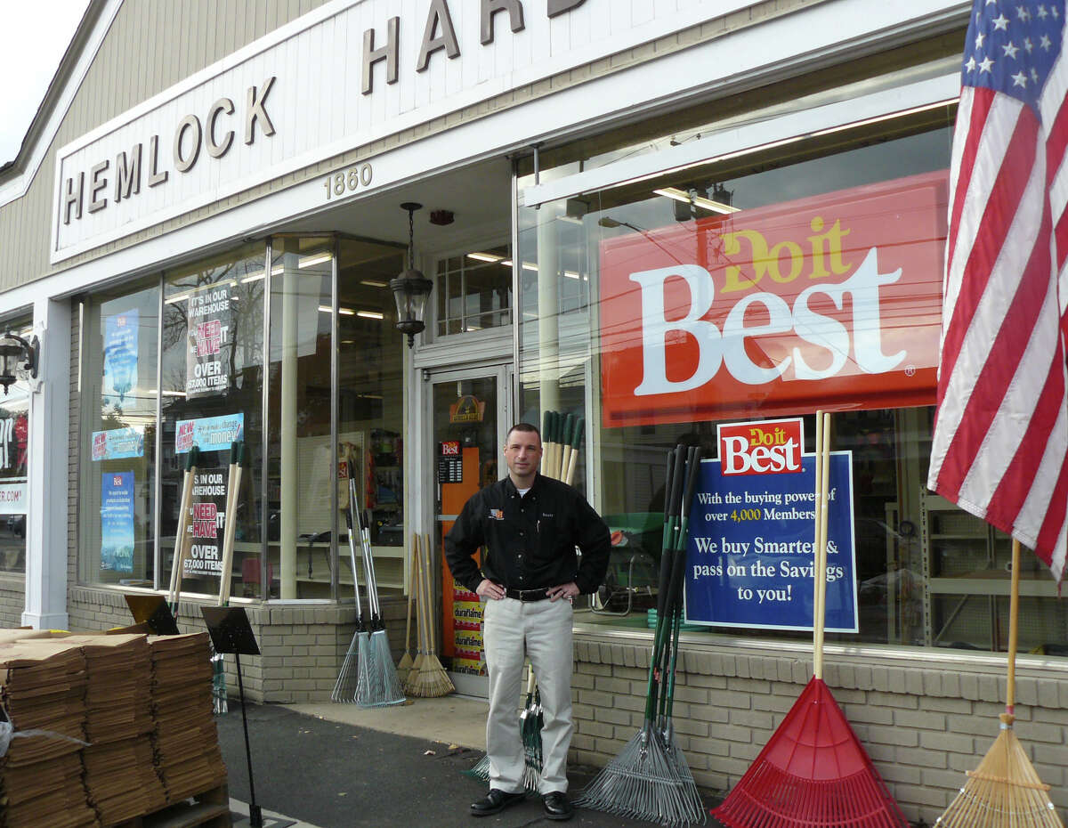 Scott Pesavento, the third-generation proprietor of his family buisness, stands outside Hemlock Hardware, which won a national award for customer servicce, community involvement and buisness acumen.