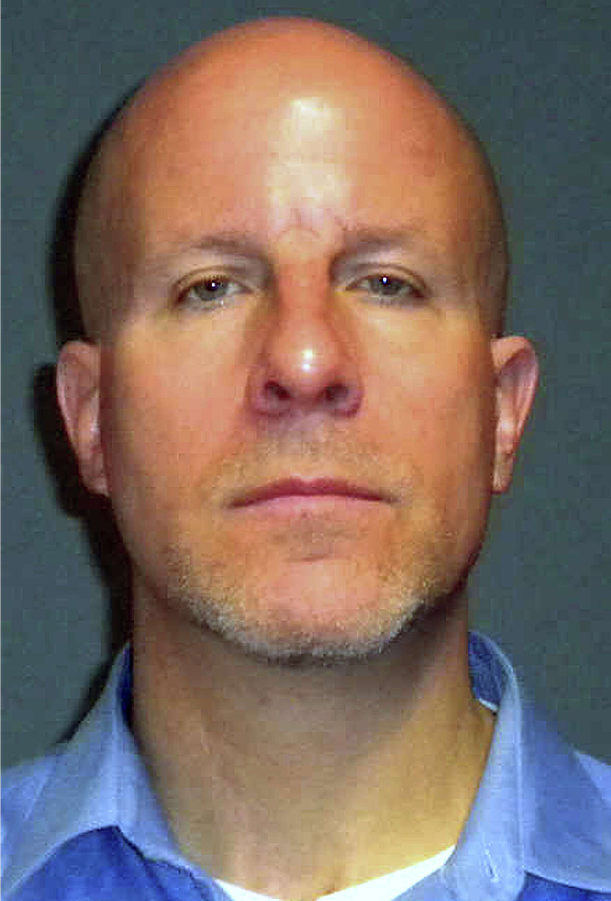 This booking photo provided by the Fairfield Police Department shows former Fairfield Ludlowe High School teacher Glenn Mishuck, of Bridgeport, Conn. Mishuck, 47, was arrested and charged Thursday, Oct. 31, 2013 with sexual assault after an investigation determined he had a sexual relationship with an under-aged female student.