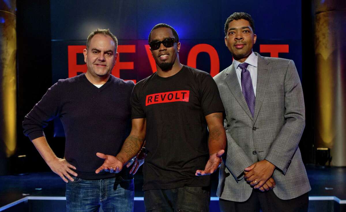 Andy Schuon (left) credits S.A. radio as his career springboard. He recently collaborated with superstar and chair of the channel Sean “Diddy” Combs (center) on Revolt TV