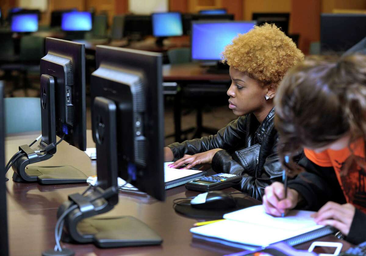 Diamond Crawford,18, works in the Math Emporium at Western Connecticut State University Thursday, Oct. 31, 2013.