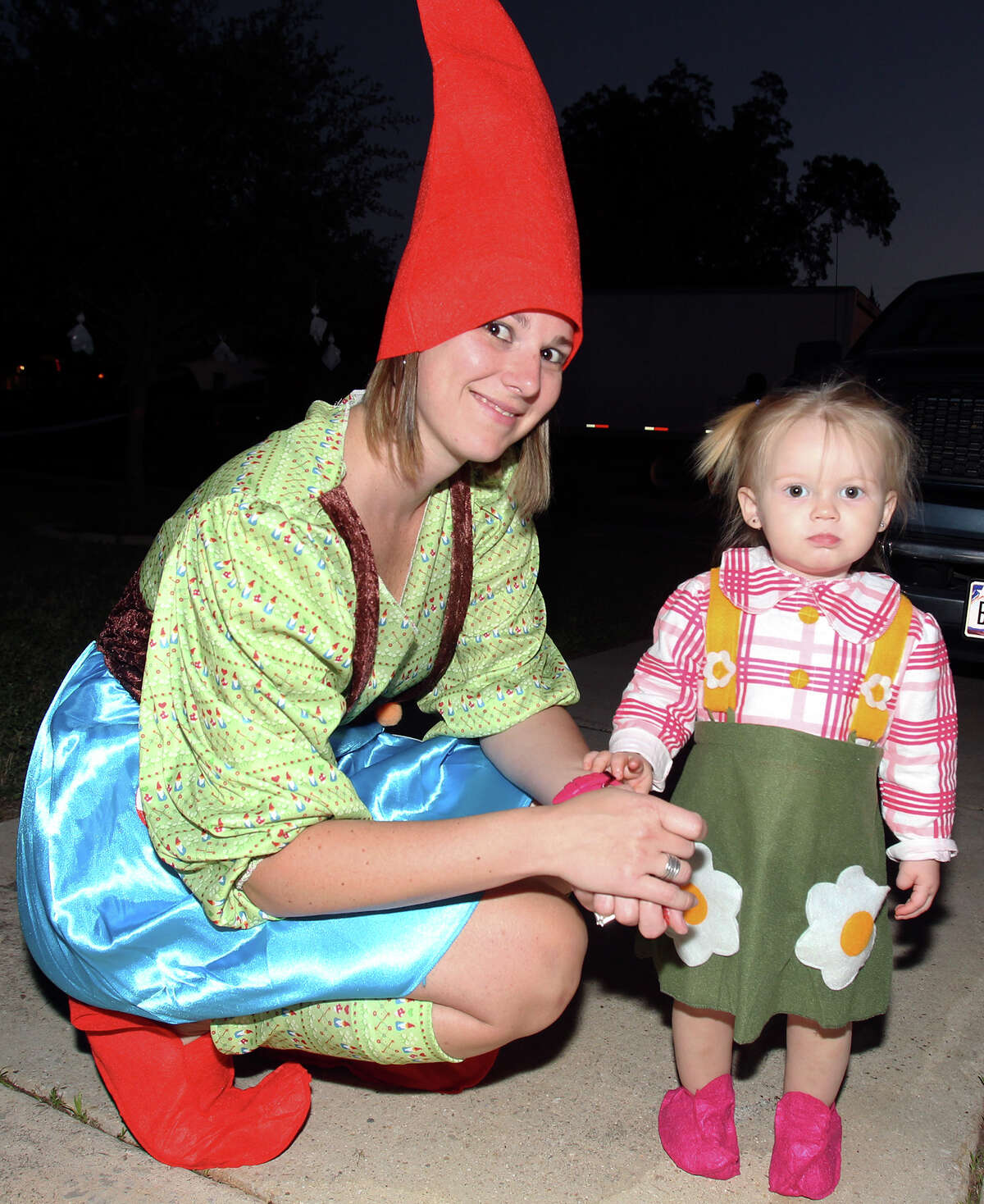 Heather Jurek enjoys the evening with daughter Addison as kids go trick-or-treating on the Southeast Side on October 31, 2013.