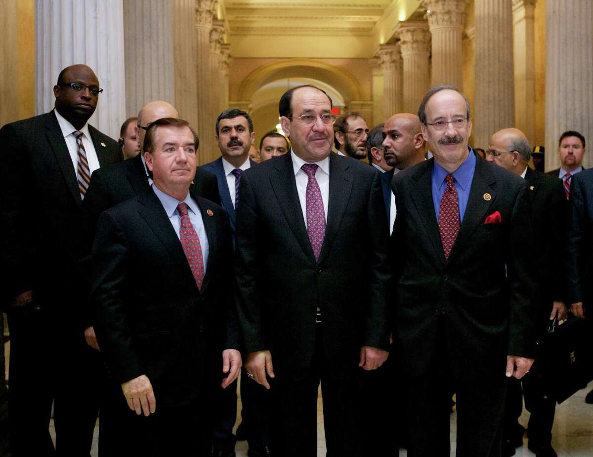 Iraqi Prime Minister Nouri al-Maliki (center) walks with the House Foreign Affairs Committee ranking Democrat Rep. Eliot Engel (right), D-N.Y., and the committee's chairman Rep. Ed Royce, R-Calif., before their meeting Wednesday in Washington.