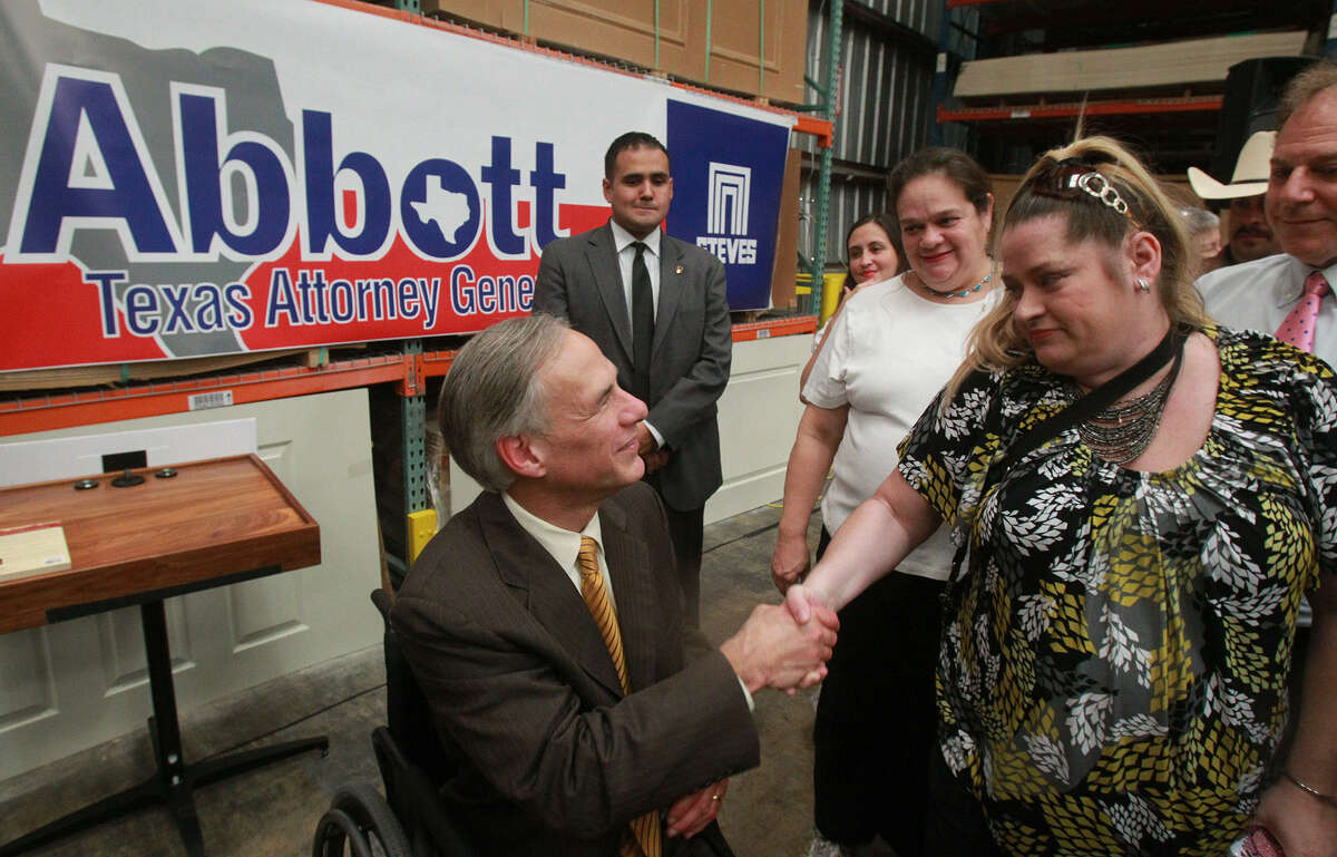 Attorney General Greg Abbott greets Vivian Brown at Steves & Sons in San Antonio. Abbott said that “to unleash the power of entrepreneurs and innovators, government must be limited.”