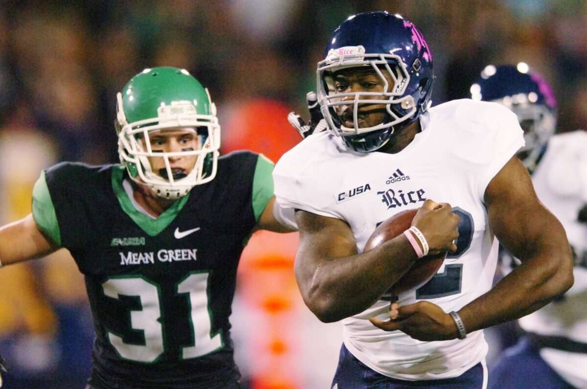 Rice running back Charles Ross (12) runs past North Texas defensive back Kenny Buyers.