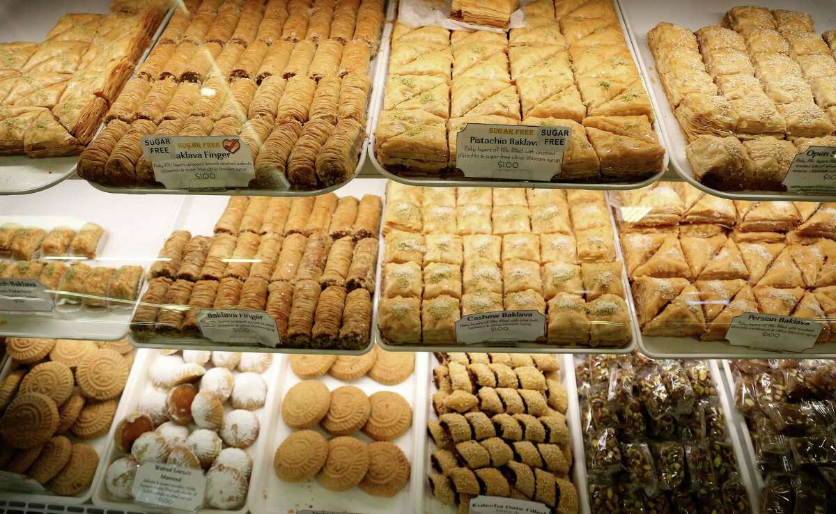 Various baklavas on display in the bakery at Phoenicia Specialty Foods, Monday, Oct. 21, 2013, in Houston. Story is about the 30th anniversary of Phoenicia Specialty Foods, which was begun by Lebanese immigrants Zohrab and Arpi Tcholakian in 1983. The business, which now includes two enormous supermarkets boasting the city's largest assortment of imported foods, began with a single shawarma.( Karen Warren / Houston Chronicle )