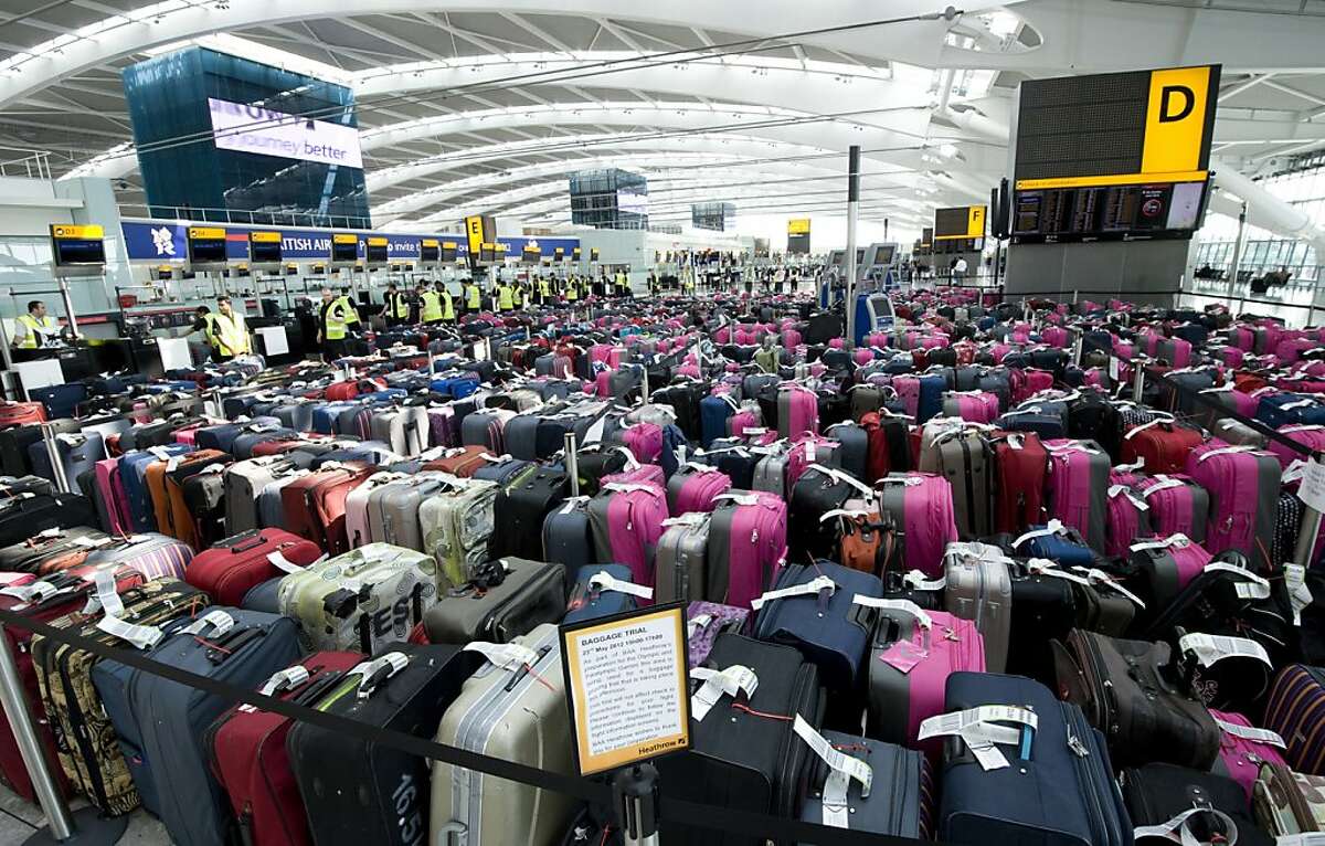FILE - In this May 23, 2012 file photo released by British Airports Authority, over 2,400 pieces of baggage are seen lined-up in Terminal 5 at Heathrow Airport during a baggage handling exercise to prepare staff at London's main airport for the forthcoming Olympic and Paralympic games, in London. Officials at Heathrow are well aware that losing or breaking the bags of high-profile athletes could be a public relations disaster - and have geared up to ensure that doesn't happen. Heathrow has recruited 1,000 Olympic volunteers clad in bright pink to help and created special teams to deal with oversize items like javelins and bikes. (AP Photo/BAA, File) NO MAGS