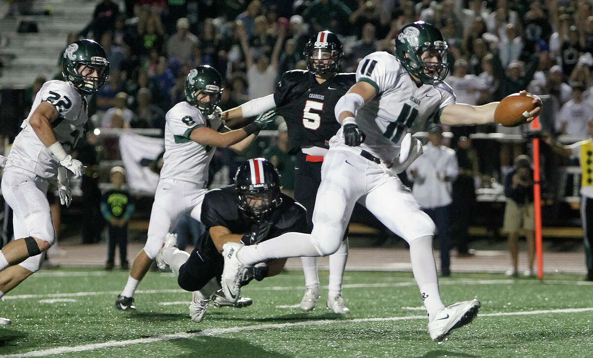 Reagan's Ty Summers (center) crosses the goal line for a five-yard touchdown, his third of the night during the second quarter of their game with Churchill at Comalander Stadium on Friday, Nov. 1, 2013. MARVIN PFEIFFER/ mpfeiffer@express-news.net