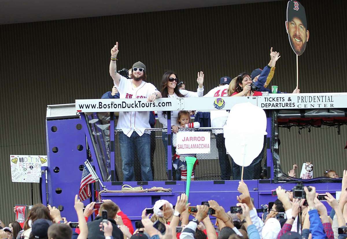 BOSTON, MA - NOVEMBER 2: Jared Saltalamacchia reacts to the crowd from one of the duck boats as they make their way down Tremont Street where fans gathered for the World Series victory parade for the Boston Red Sox on November 2, 2013 in Boston, Massachusetts.