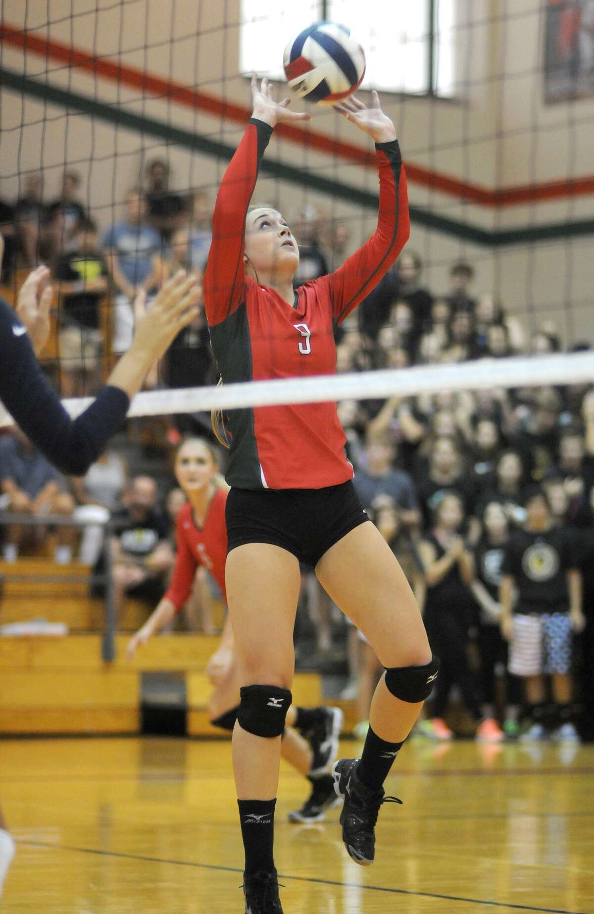 The Woodlands senior setter Courtney Eckenrode makes a play versus College Park.
